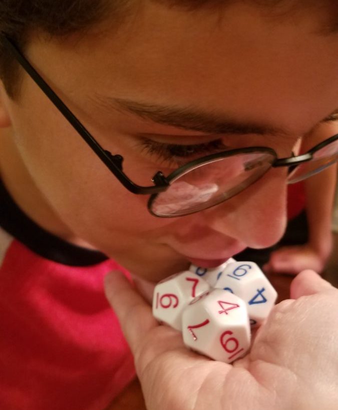 whispering to dice for good luck